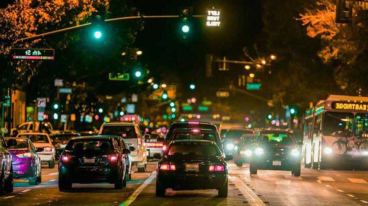 Traffic going through a green light.