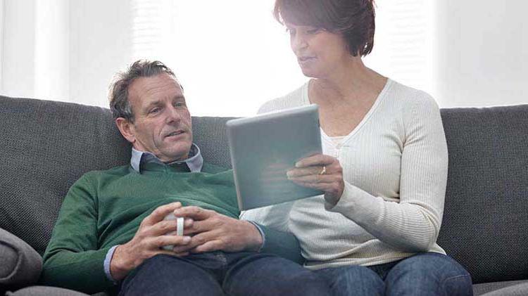 Couple looking at an investment portfolio.