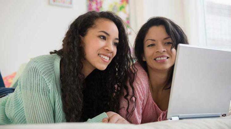 Mother and daughter applying for college scholarships together.