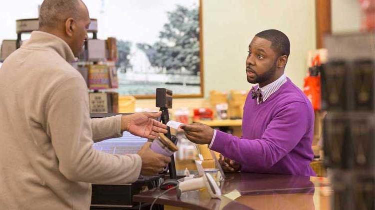 Cashier talking to a customer