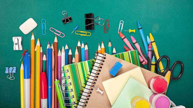 School supplies consisting of crayons, scissors, paint, eraser, notebooks, colored pencils, paper clips, markers, etc.